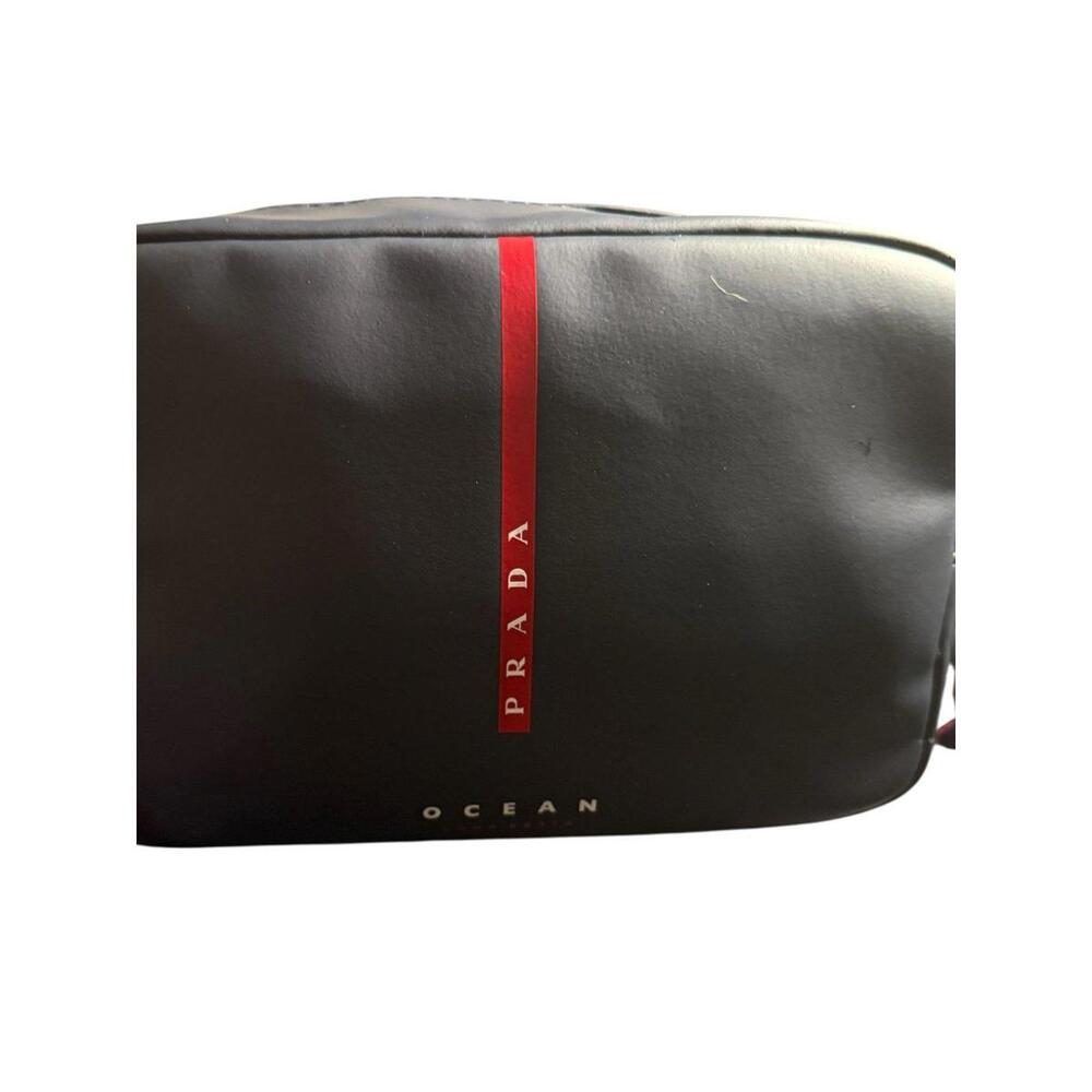 PRADA Luna Rossa Dark Blue Man Toiletry Bag With Dust Bag with a shoulder strap.